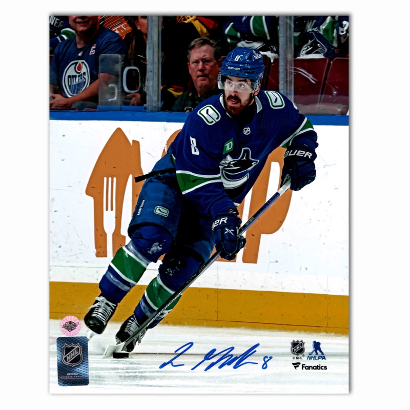 Conor Garland Autographed Vancouver Canucks Home 8×10 Photo (With Puck)